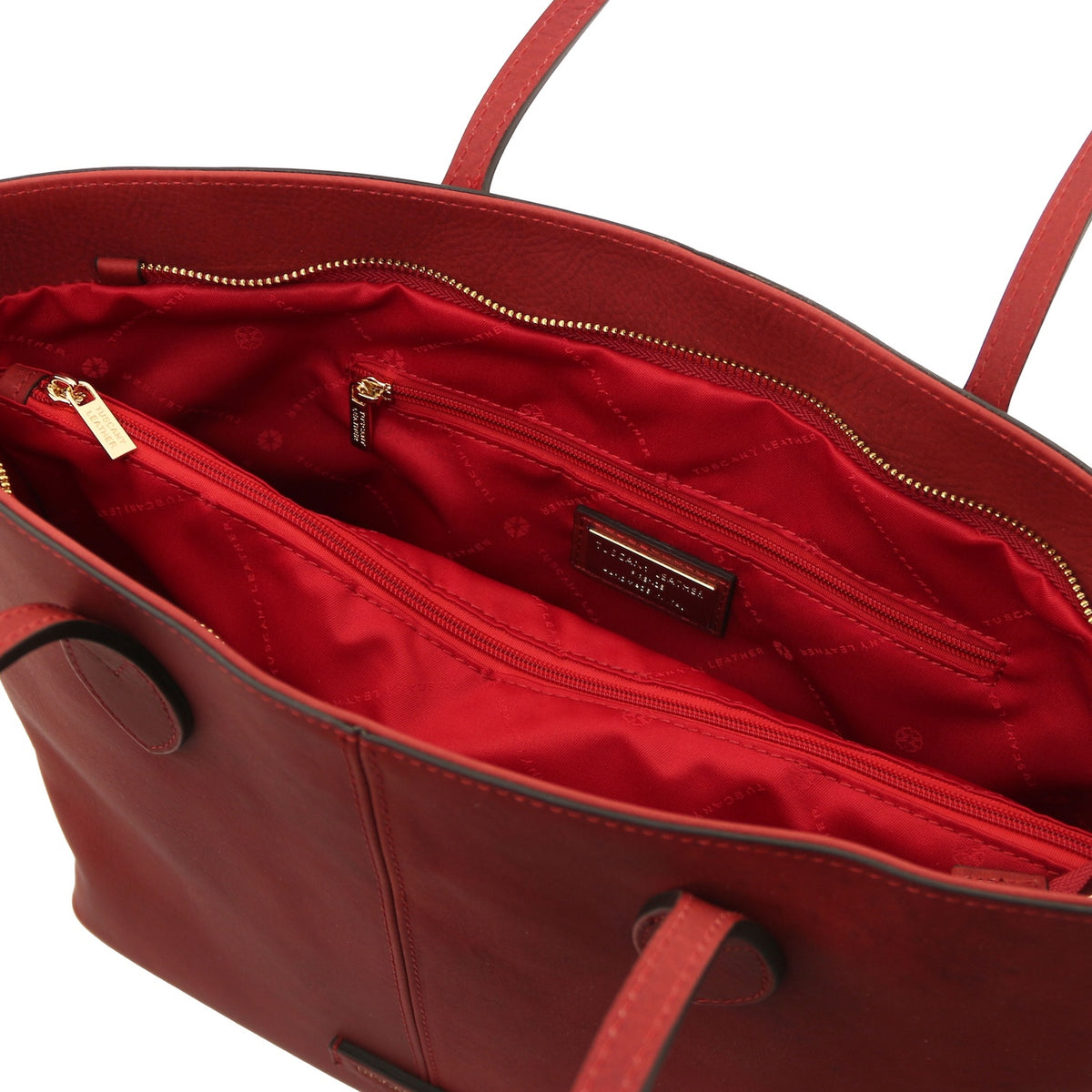 Red handbag with gold zipper on a white background