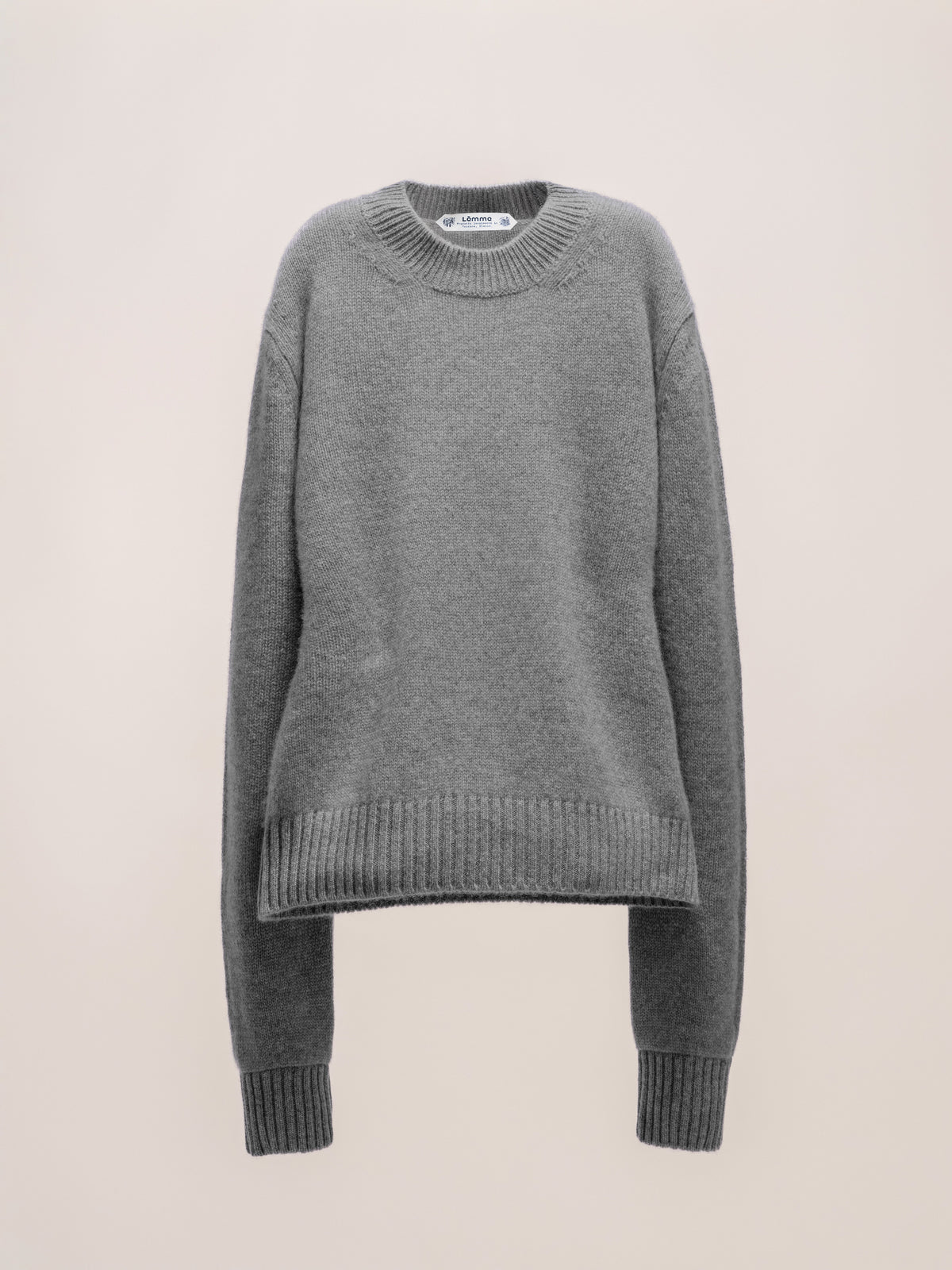 Gray sweater on a beige background