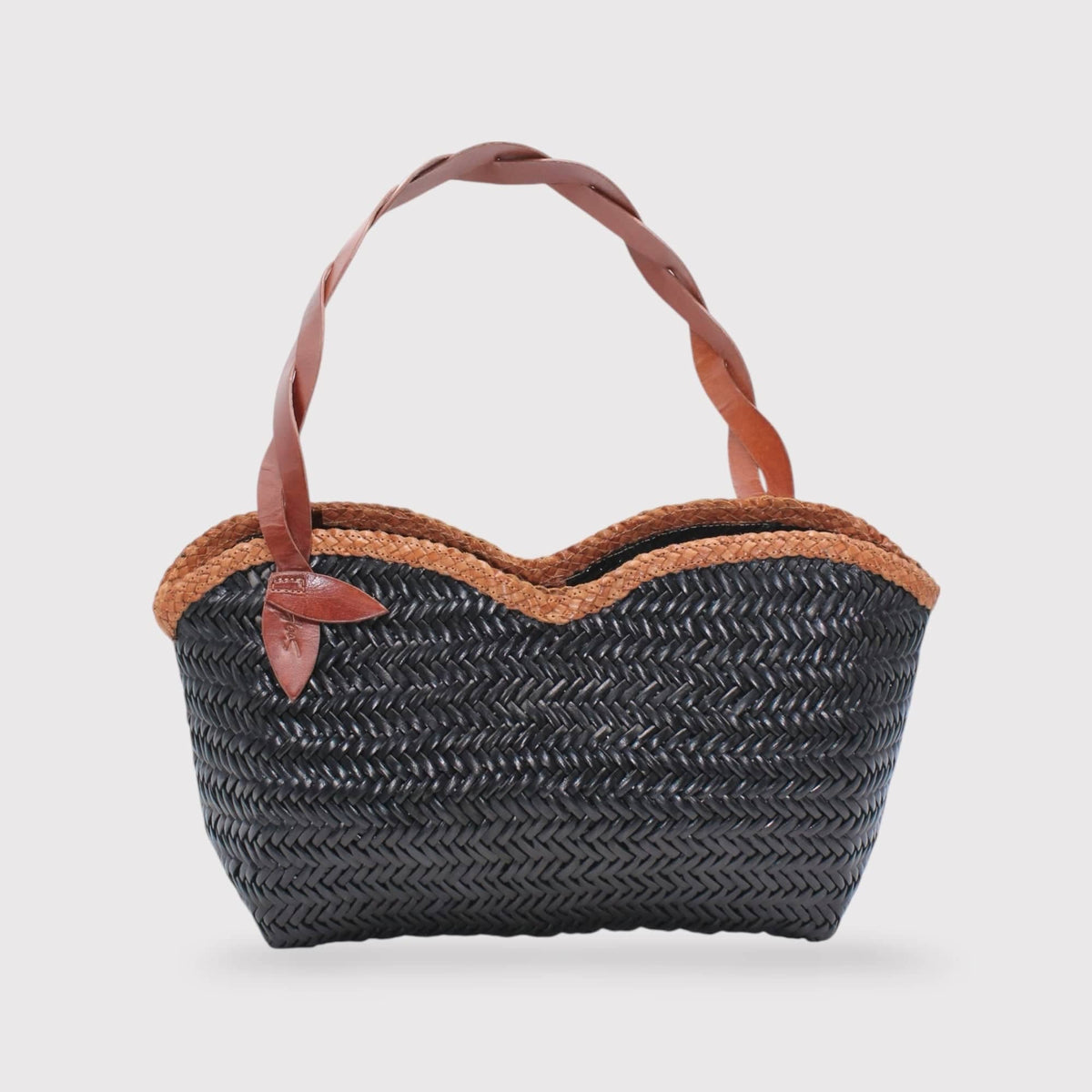 Léafa - Handwoven Leather Shoulder Bag | Brown & Black featuring braided leather handle and woven black body with brown trim edges.