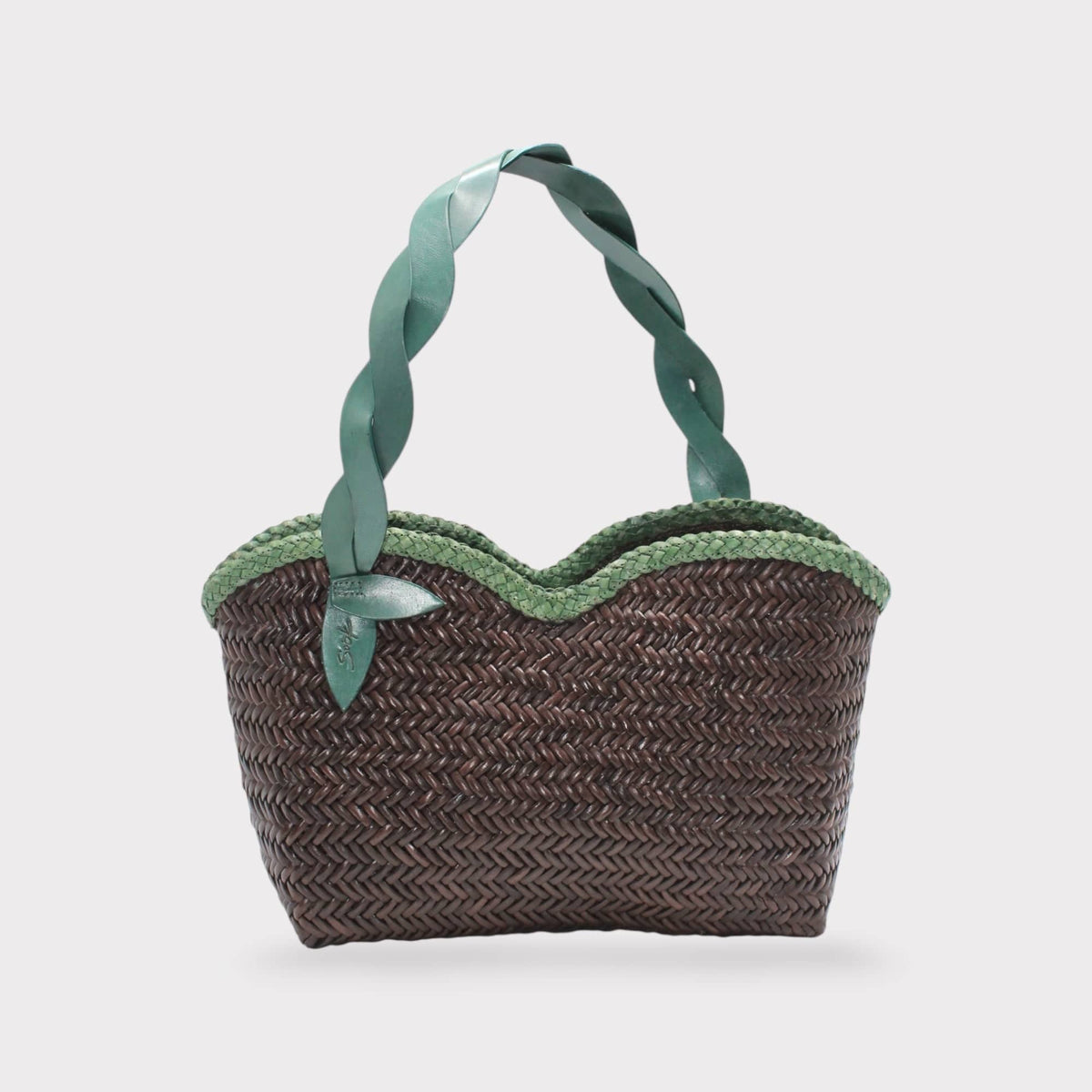 Léafa - Handwoven Leather Shoulder Bag | Vert & Café featuring a woven dark brown body with scalloped green trim and twisted green leather handles