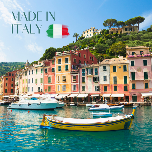 Colorful Italian seaside village with boats in the harbor and a Made in Italy brushstroke flag.