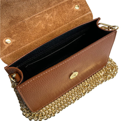 Brown leather handbag with gold chain strap on a white background