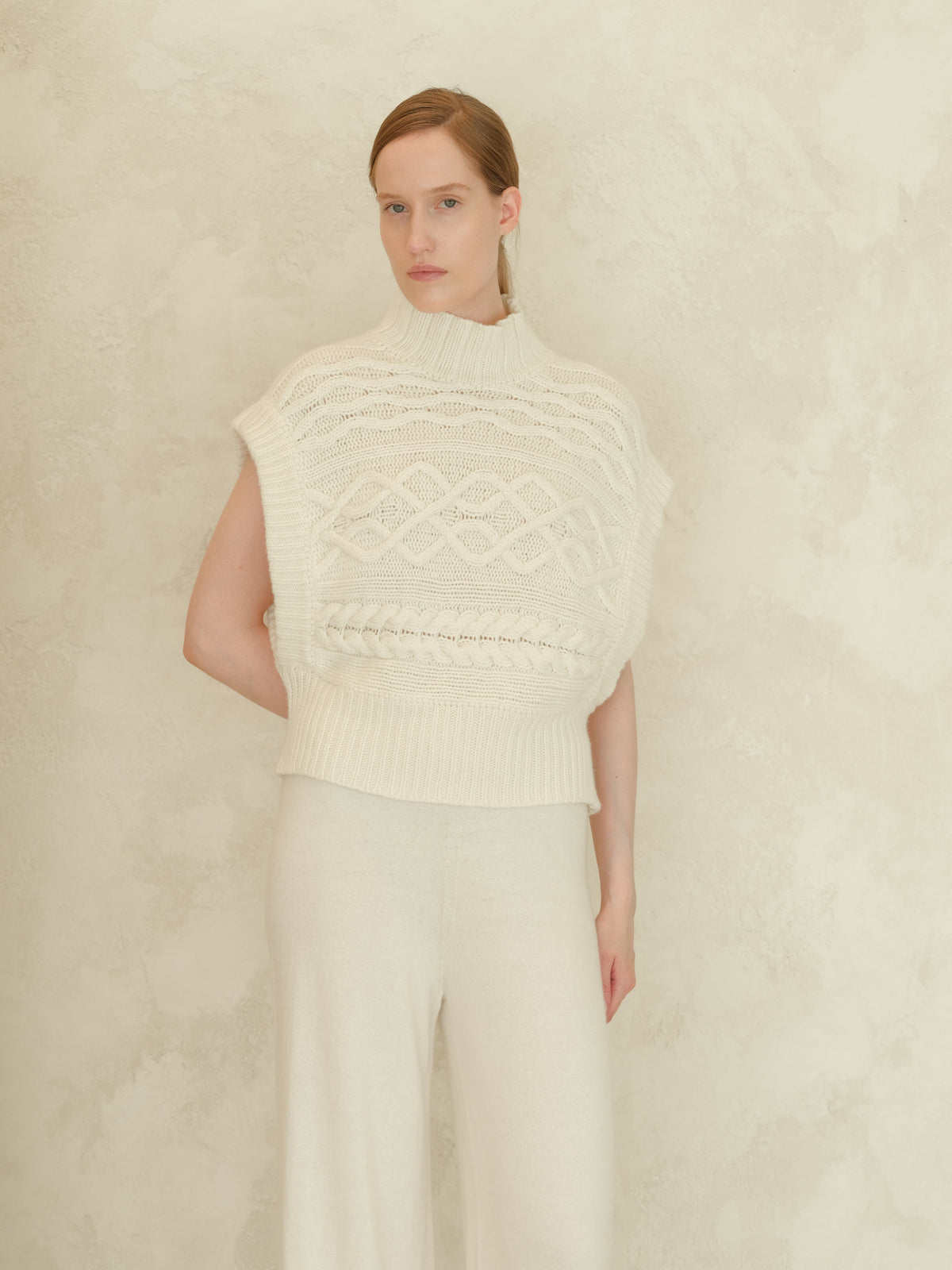 Cream Cashmere Mix Maxi Cable Tunic worn by a model with a high ribbed neck and chunky knit cable pattern.