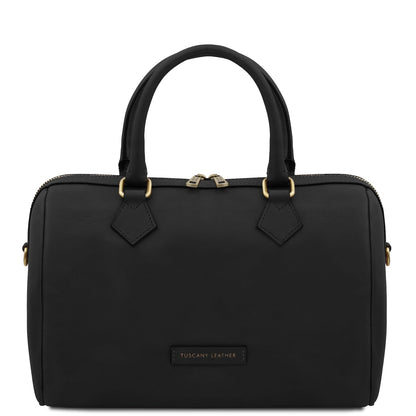 Black handbag with gold accents on a white background
