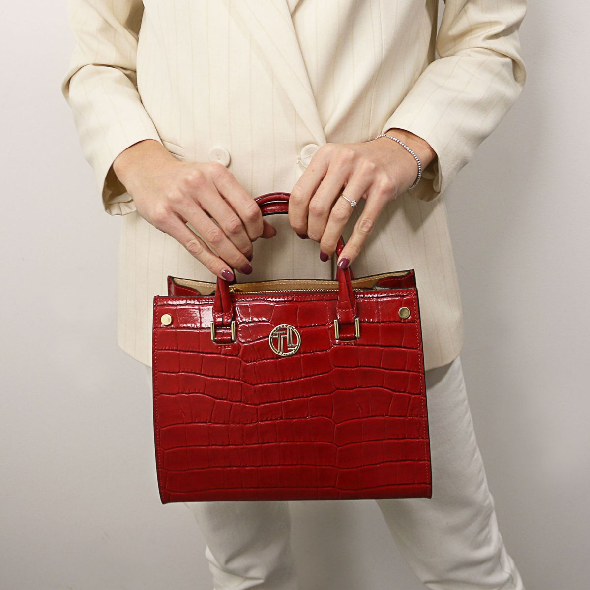 Croque - Croc print leather tote handbag | TL142504 in glossy red with structured silhouette, top handles, and gold-tone hardware held against neutral outfit.