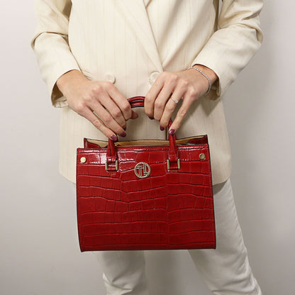 Croque - Croc print leather tote handbag | TL142504 in glossy red with structured silhouette, top handles, and gold-tone hardware held against neutral outfit.