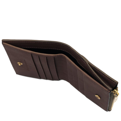 Brown leather wallet opened to reveal multiple card slots and a zippered section.