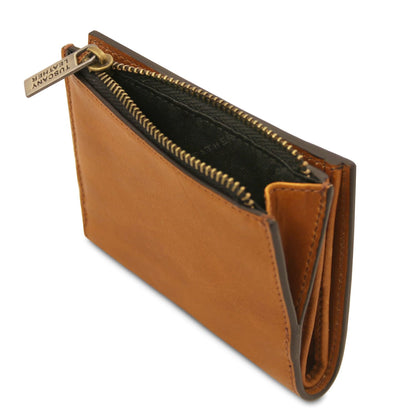 Close up of tan leather zip wallet with top zipper and brass pull tag