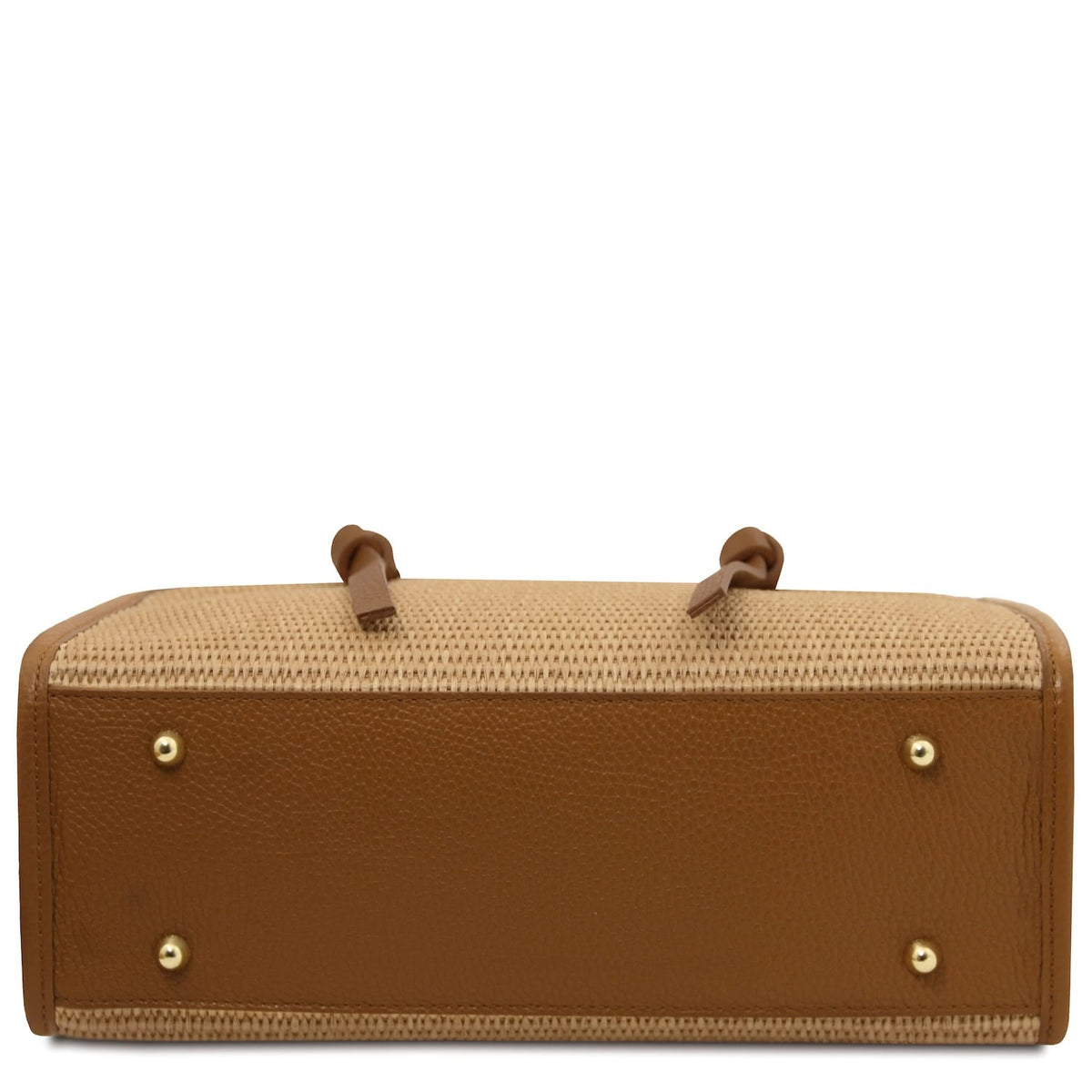 Bottom view of straw effect bag with tan leather base and four gold studs