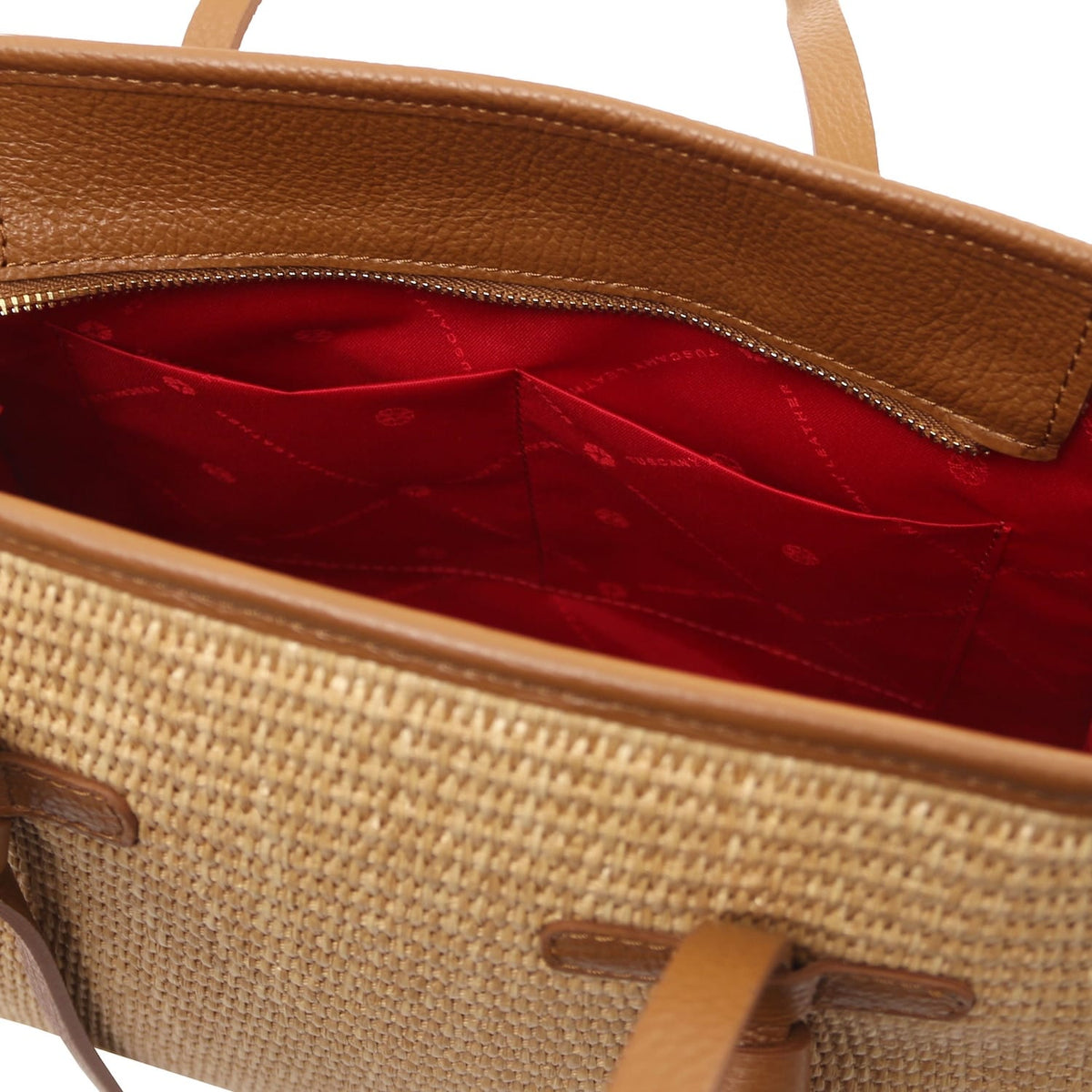 Inside view of Frame straw effect shoulder bag showing red lining and multiple pockets