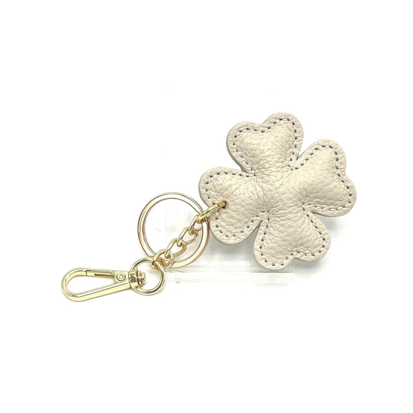 Beige Italian leather four-leaf clover keyring and bag charm with gold hardware