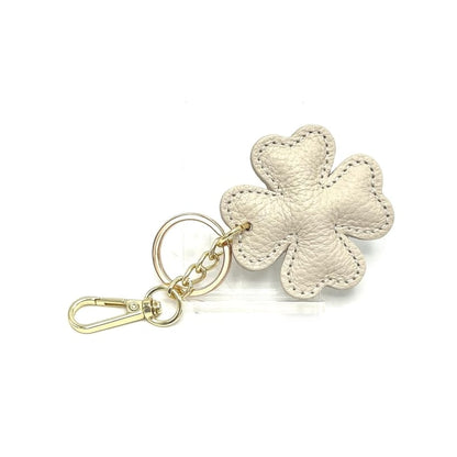 Beige Italian leather four-leaf clover keyring and bag charm with gold hardware