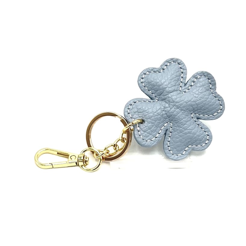 Blue Italian leather four-leaf clover keyring and bag charm with gold hardware