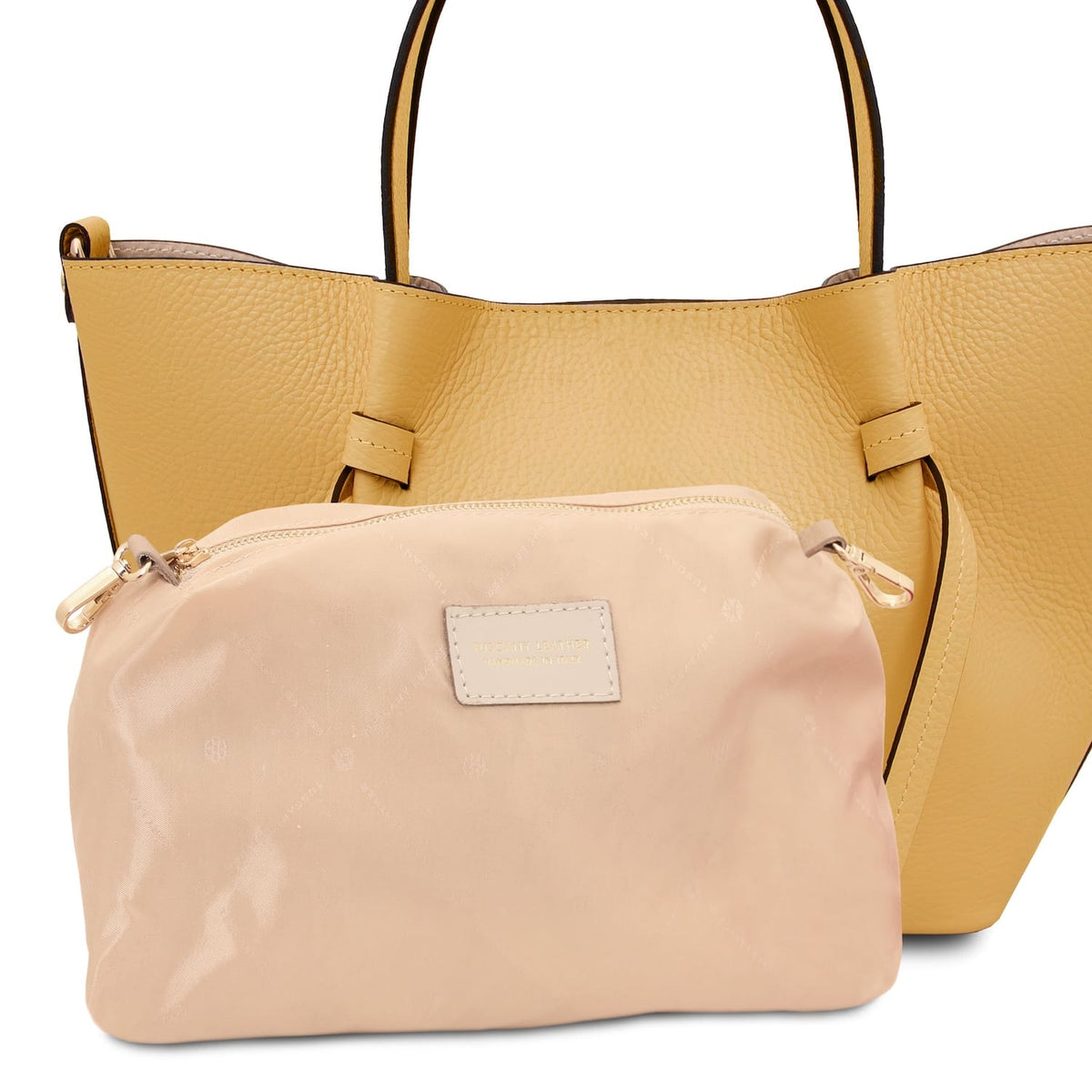 Vista frontal of Legame small yellow leather handbag with beige trim and a beige pouch inside.