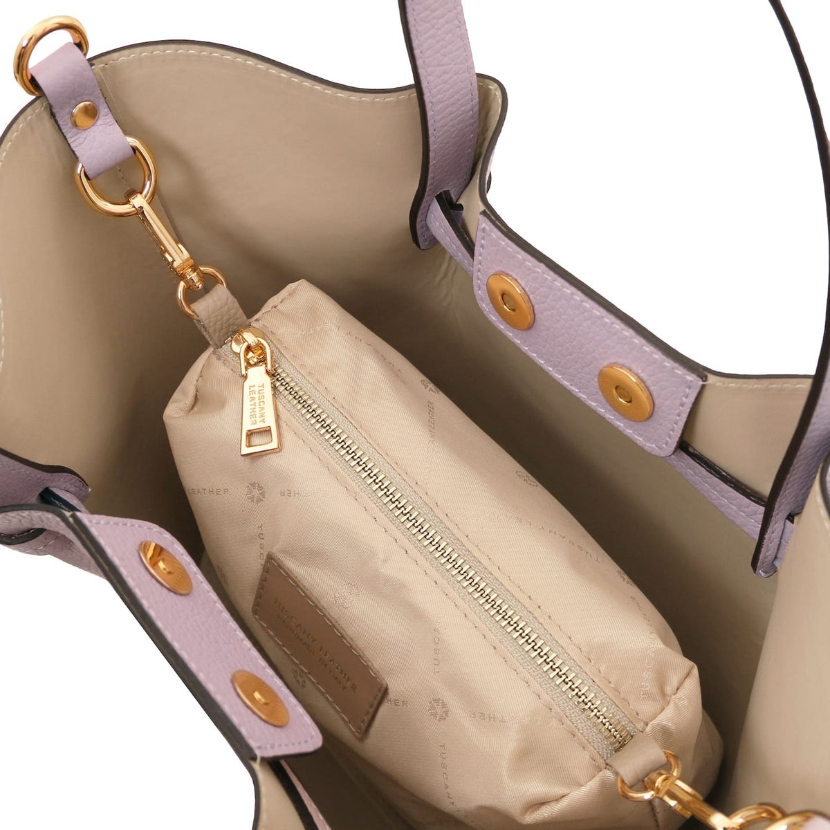 Interior of Legame small lavanda leather handbag with forro beige and zip pouch.