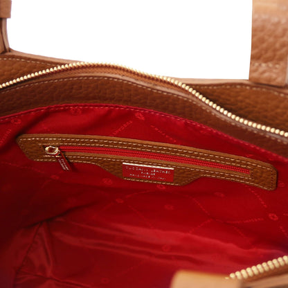 Interior view of Libra long handle leather tote with red lining and zip pocket