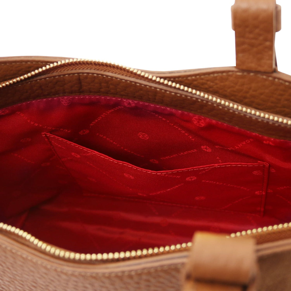 Inside Libra tote with red lining and stitched zip pocket
