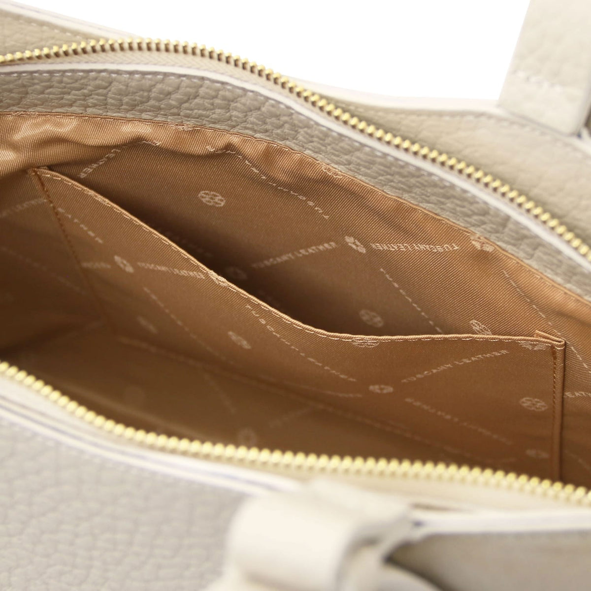 Interior view of Libra long handle leather tote with tan lining and inner pocket.