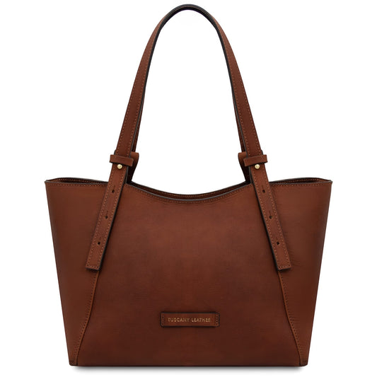 Front view of Libra brown leather tote with long straps and small brand plaque
