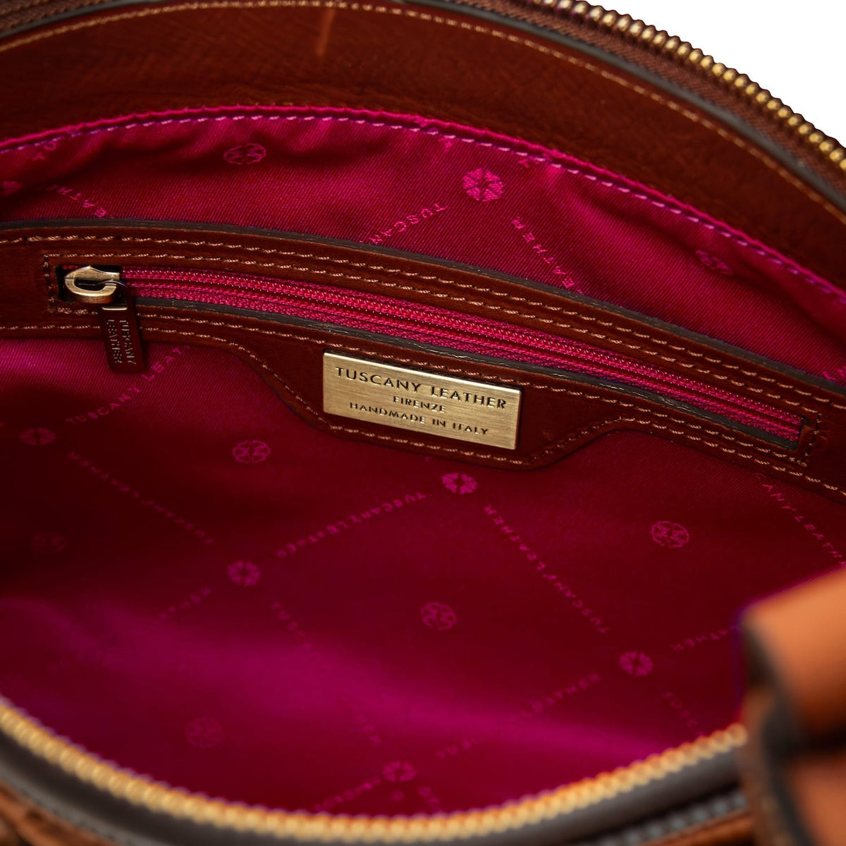 Interior of Libra tote with pink patterned lining and zip pocket