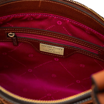 Interior of Libra tote with pink patterned lining and zip pocket