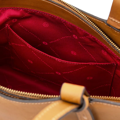 Red lining inside the Libra tote with stitched pocket and visible zipper along the top opening.