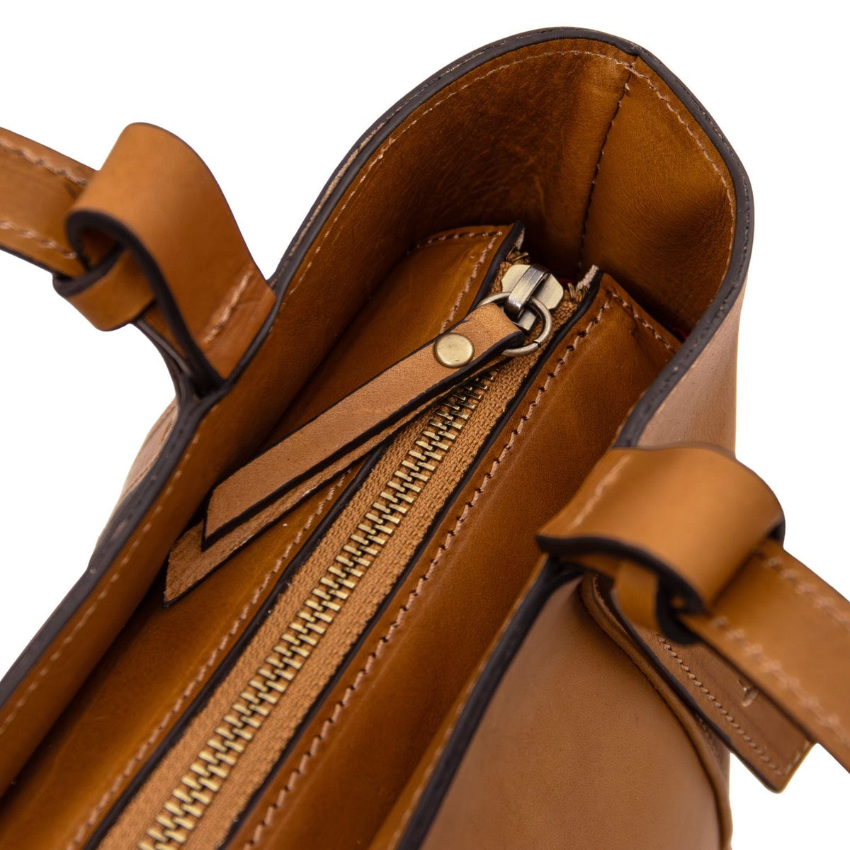 Interior view of the Libra tote with tan leather trim and top zipper.