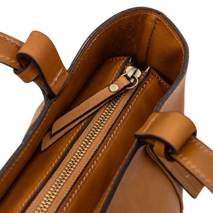 Interior view of the Libra tote with tan leather trim and top zipper.