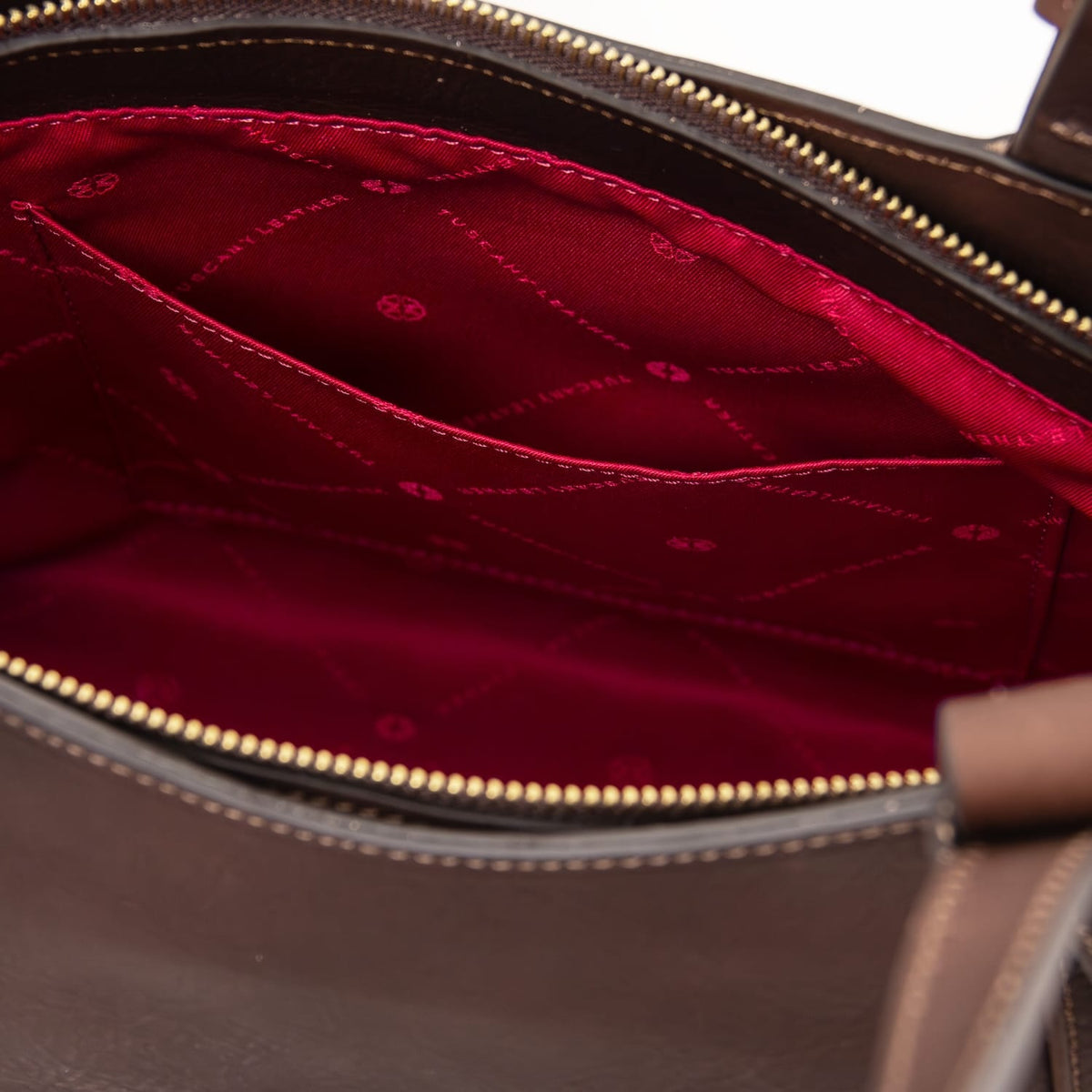 Close view of Libra tote interior showing red lining and zip pocket