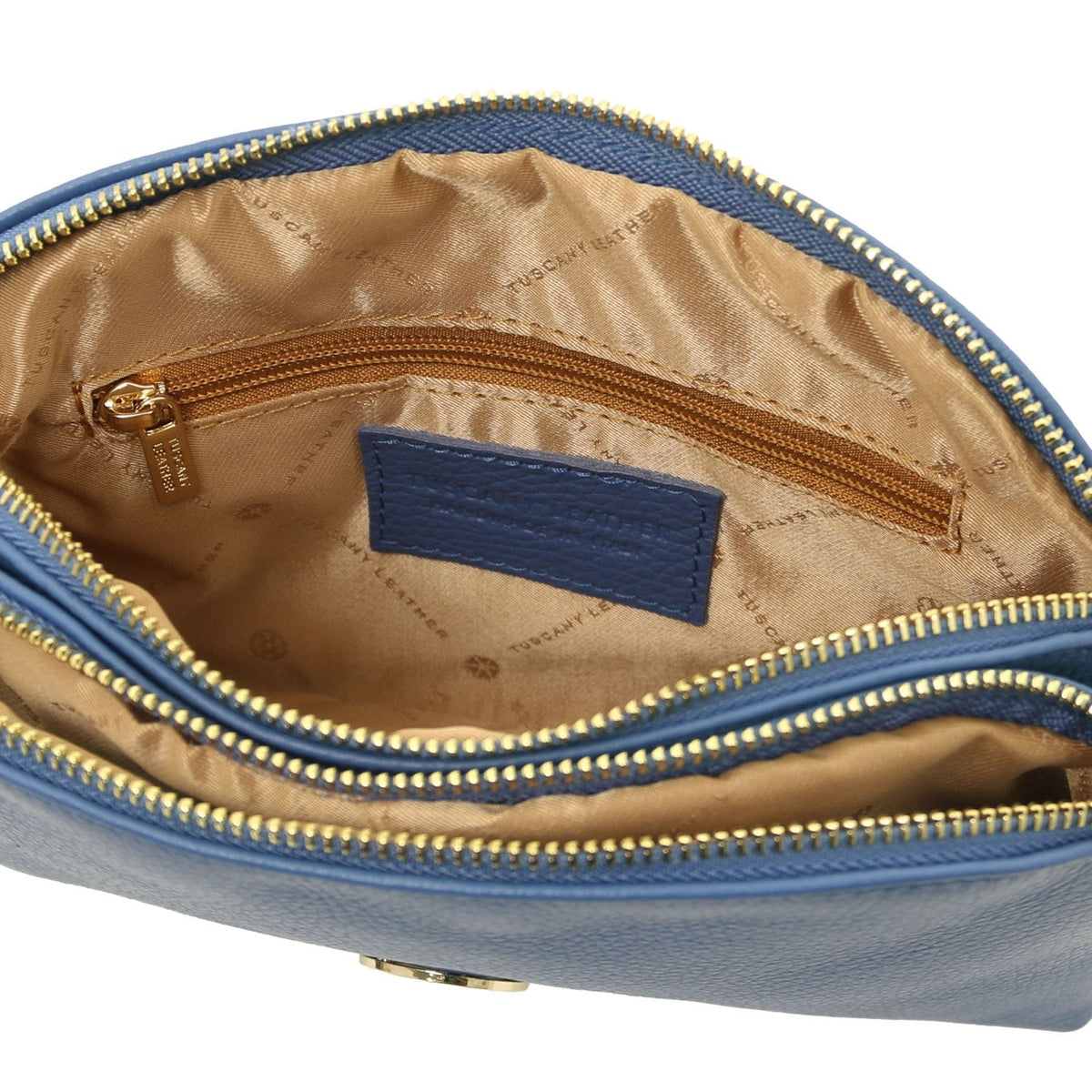 Open blue Lily bag with tan lining double gold zippers and inner zip pocket