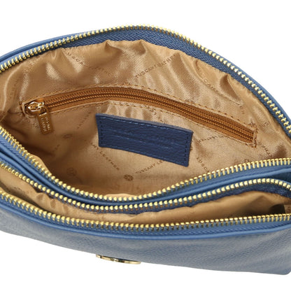 Open blue Lily bag with tan lining double gold zippers and inner zip pocket