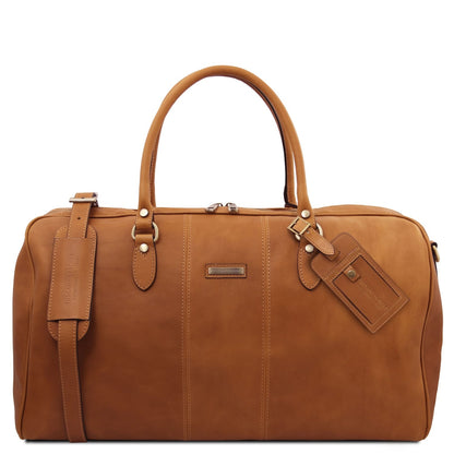 Lisbona travel leather duffle bag large size in cognac leather with deux poignées supérieures and luggage tag