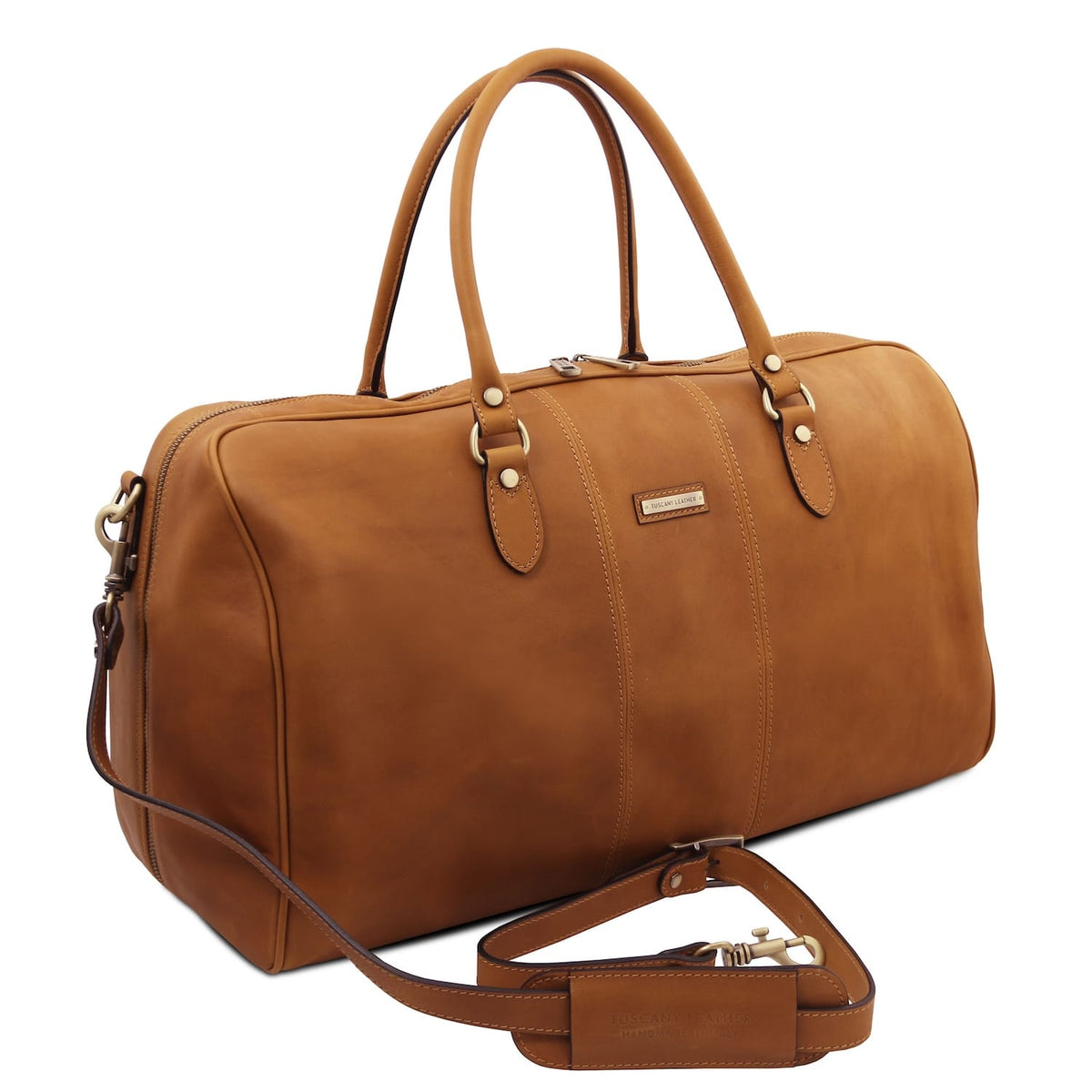 Angled view of Lisbona large travel leather duffle with bandoulière amovible