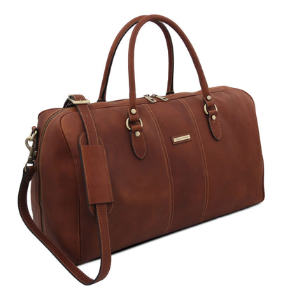 Lisbona large travel leather duffle bag in brown with deux poignées supérieures and bandoulière amovible vue de face