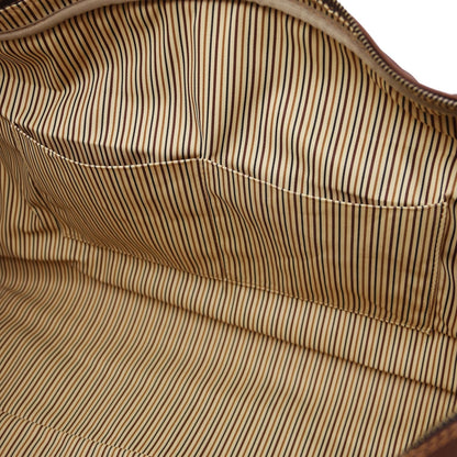 Vue intérieure highlighting a stitched pocket and striped lining.