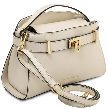Beige handbag with gold accents on a white background