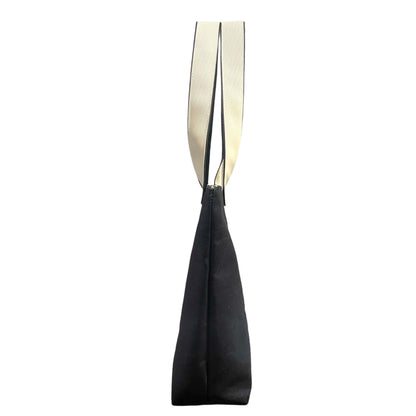 Navy denim bag with a white strap on a white background