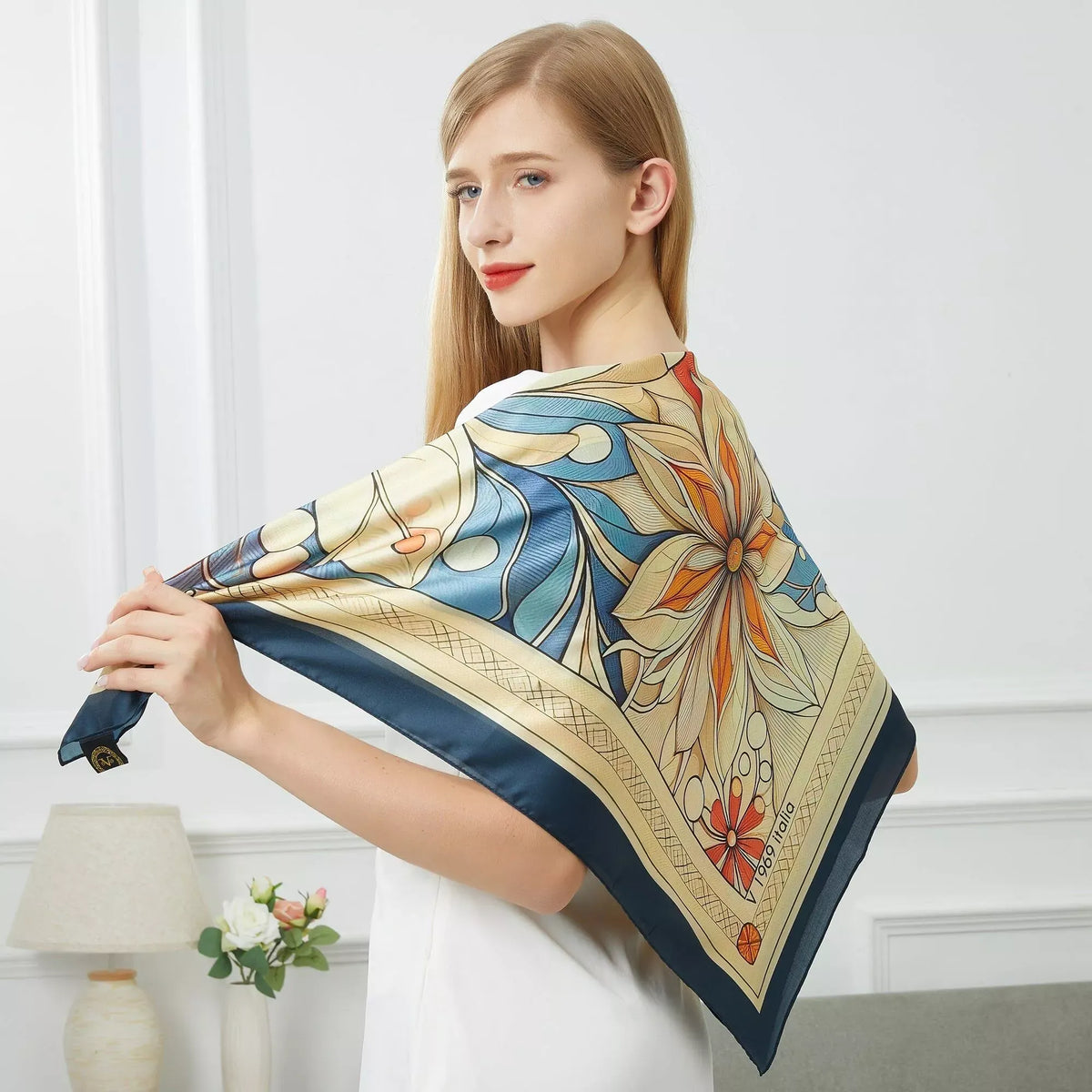 Mystic Flowers Large Square Silk Cachecol (90 × 90 cm) featuring intricate floral and leaf patterns in blue, orange, and cream tones.