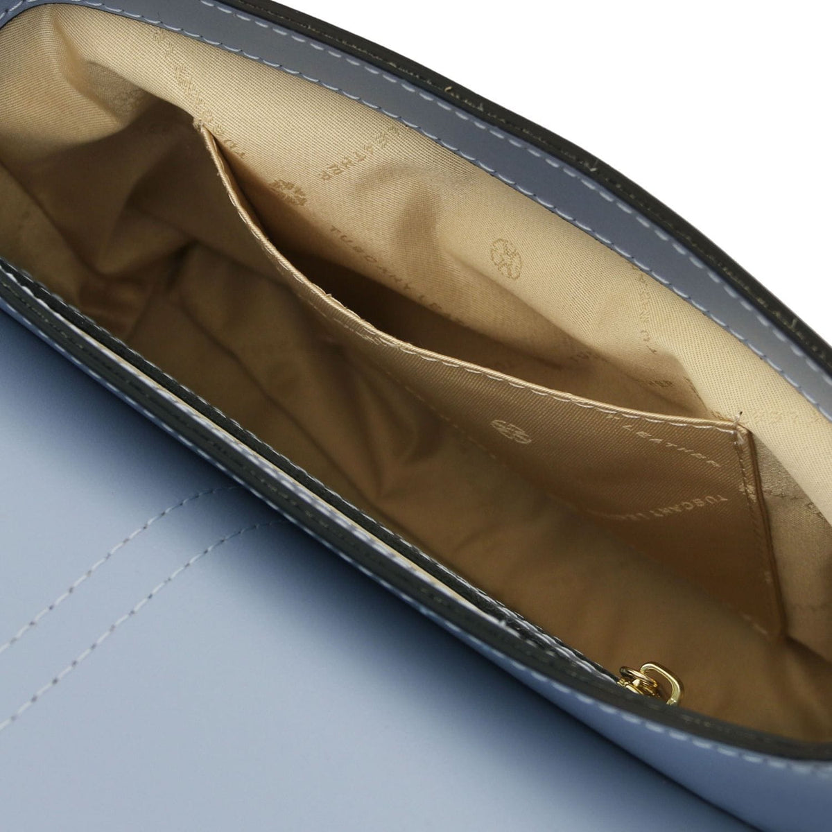 Interior of the Nausica bag with forro beige and a stitched bolsillo abierto along the side