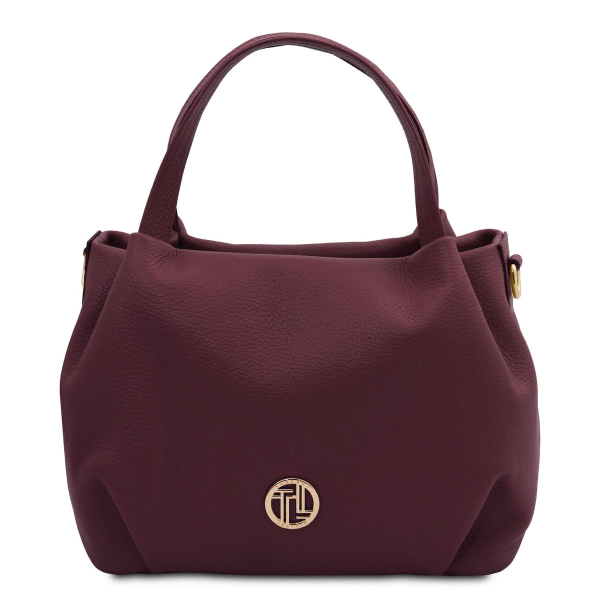 Nora - Soft leather handbag | TL142372 in burgundy pebbled leather with dual top handles and gold-tone round emblem on white background