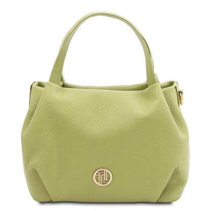 Soft lime green leather handbag with rounded silhouette, dual top handles, and subtle gold-tone emblem detail.