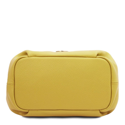 Yellow soft leather handbag with pebbled texture, rounded edges, and structured rectangular base.