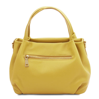 Yellow soft leather handbag with a pebbled texture, gold zipper pocket, and dual top handles, crafted in Italian leather.