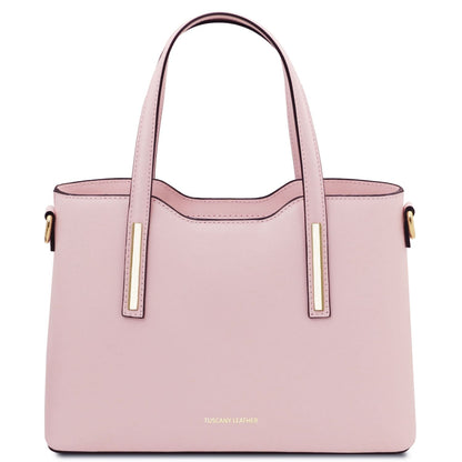 Pink handbag with gold accents on a white background