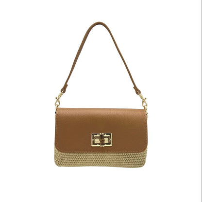 Tan and straw shoulder bag with a gold clasp on a white background