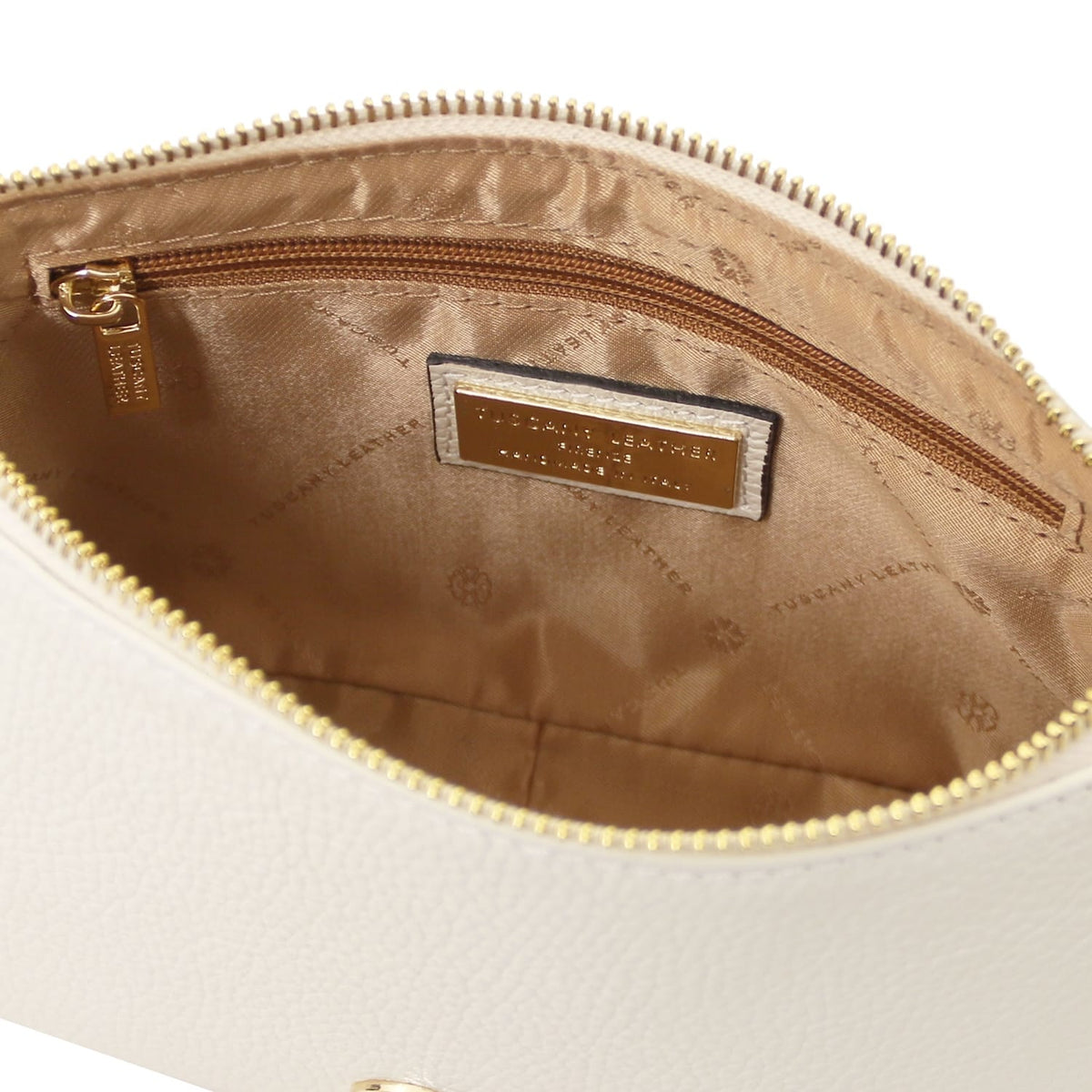 Tan interior of Parfait leather clutch with zip pocket and gold brand plaque