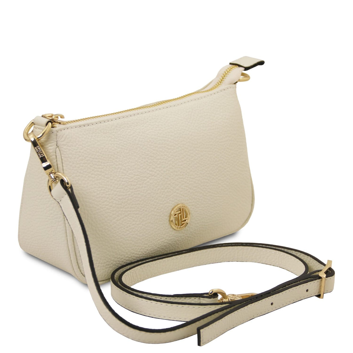 Beige pebbled leather clutch with gold zipper and circular gold logo plaque.
