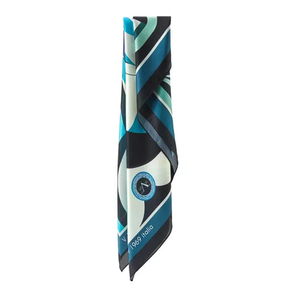 Pelican Large Square Silk Scarf | Blue (90 × 90 cm) showing folded silk fabric with teal, black, and white geometric and circular motifs.