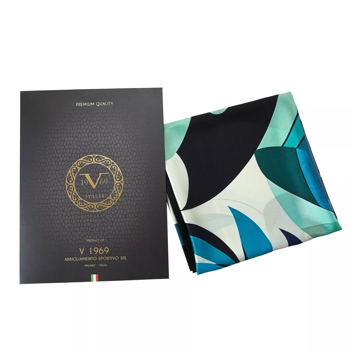 Pelican Large Square Silk Scarf | Blue (90 × 90 cm) folded with abstract blue, teal, and black geometric patterns beside black textured packaging.