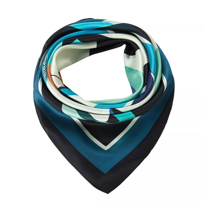 Pelican Large Square Silk Scarf | Blue (90 × 90 cm) folded to showcase teal, black, cream, and navy geometric patterns on silk fabric.